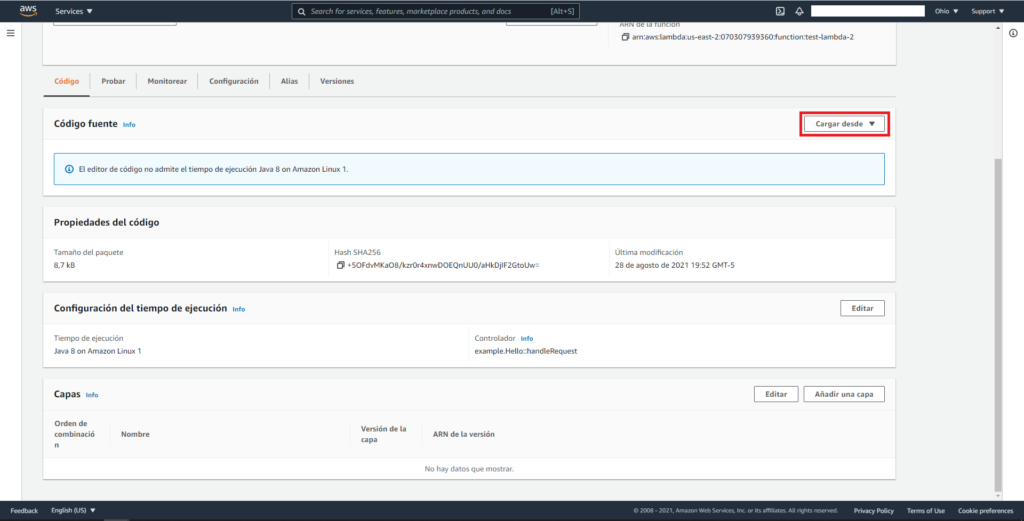 Captura de pantalla de AWS mostrando el panel de "test-lambda". En la sección de Código, Código Fuente, se esta remarcando  la opción de: "Cargar desde".